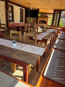 a row of tables and chairs in a restaurant at Guesthouse Jurcek in Zreče