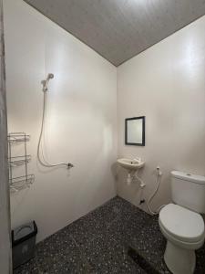 a bathroom with a toilet and a sink at Chika House in Gili Trawangan