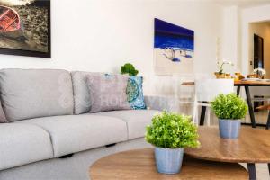 a living room with a couch and a table at Apartment El Breeze in Paralimni