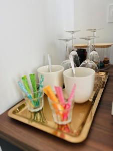 a tray with bowls and chopsticks on a table at La Maison Kerguelen - Suite in Quimper