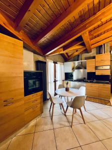 a kitchen with a table and chairs in a room at BEddy & Breakfast - Station Loft in Seregno