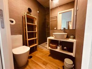 a bathroom with a sink and a toilet and a mirror at Casa Jardim in Porto +78 photos