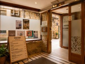 a room with a sign in front of a building at Hotel Boa Vila in Pontevedra +16 photos