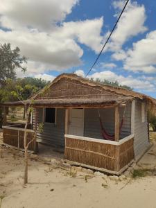 a small house with a rusty roof on top of it at Espace baleine Anakao in Anakao