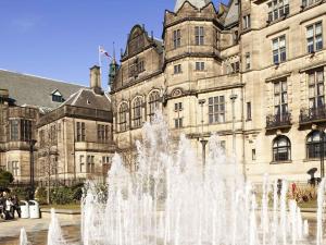 a fountain in front of a large building at Novotel Sheffield Centre in Sheffield