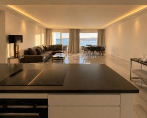 a living room with a couch and a table at B51 Executive Flats Marbella in Marbella