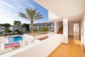 a view from the balcony of a house with a swimming pool at The Loft House Ibiza in Santa Eularia des Riu