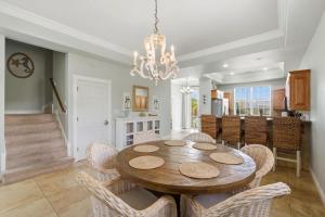 a dining room with a table and chairs at Periwinkle Paradise in Navarre
