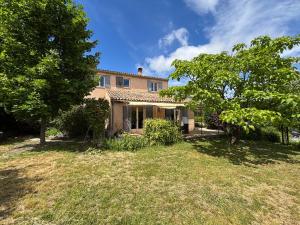 a large house with trees in the yard at Les Freds in Ventavon