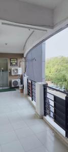 a view from the inside of a building with a balcony at Hotel Radhe Inn in Gandhinagar +21 photos