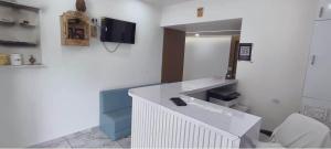 a bathroom with a sink and a mirror at Hotel Radhe Inn in Gandhinagar