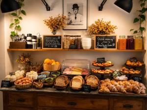 a buffet filled with lots of different types of food at Borgo Vergini Garden B&B in Naples
