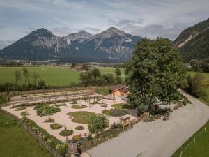 an aerial view of a garden with mountains in the background at Apart Pichler in Schlitters