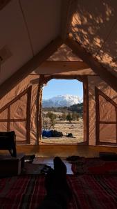 a room with a large window in a tent at Bosnian Nature Glamping in SJJ