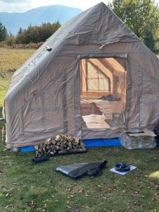 a tent is set up in a field at Bosnian Nature Glamping in SJJ +16 photos