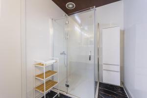 a bathroom with a shower with a glass door at Ladanjsko Imanje Principovac in Ilok +36 photos