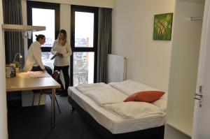 Ein Bett oder Betten in einem Zimmer der Unterkunft The ASH