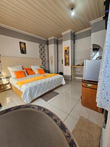 a bedroom with a bed and a flat screen tv at Turfloop guest house in Ga-Mothapo