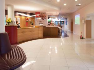 a lobby of a hospital with a waiting room at Hotel ibis Faro Algarve in Faro +89 photos