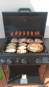 a box with pizzas and other food items at GuestElia Gozo in Nadur