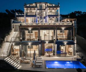 a house with a swimming pool in front of it at Callisto Azzure in Zakynthos