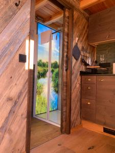 a room with a large window in a cabin at Garnecker Freiheit in Reut +28 photos
