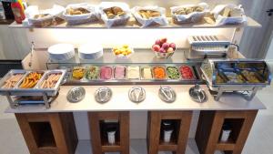 a buffet filled with lots of different types of food at Elite Pension in Štúrovo