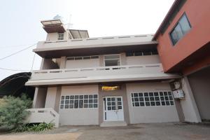 a building with a sign on the front of it at Hotel Keshav Pride in Dhule +20 photos