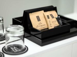 a black box filled with books on a counter at Nemzeti Hotel Budapest - MGallery Collection in Budapest
