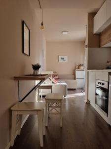 a living room with a table and a couch at Vila Lucic Zlatibor in Zlatibor