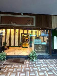 a lobby of a building with a glass door at Premium Hotel EXO-Near Temple and Ghat#Parking and Comfort Stay#Premium Service in Varanasi