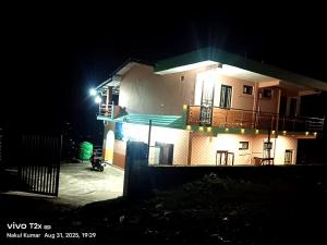 a house at night with a light on it at Aasara Homestay Bhimtal Orchard Villa in Bhīm Tāl