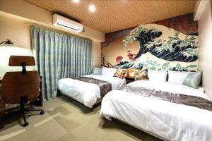 a hotel room with two beds and a painting on the wall at HOTEL StayLuck MARUGAME - 無料駐車場 in Marugame
