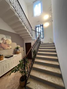 a staircase in a home with a stair case at Le Dolci Dimore in Virgilio +39 photos