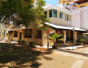 a street with a building on the side of a road at Villa Waves in Pondicherry