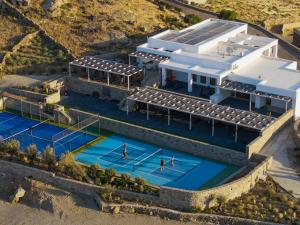 an aerial view of a house with a tennis court at Cali Mykonos in Kalafatis