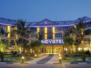 a hotel with a sign that reads novo hotel at Novotel Cotonou Orisha in Cotonou