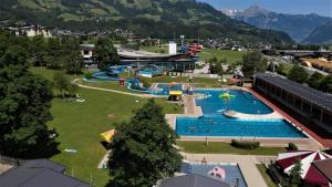 an amusement park with a large swimming pool at Appartement Schatz in Uderns