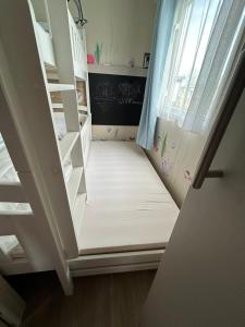 a small staircase in a room with a window at ZeeGlück in Oostkapelle