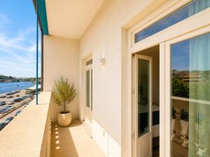 a house with a balcony with a view of the ocean at Ribeira Porto by MyStay - Self Check-in Hotel in Porto +55 photos