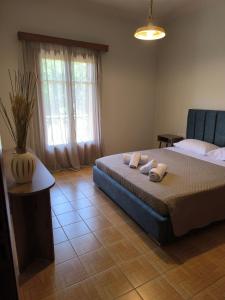 a bedroom with a bed with two pillows on it at Sonata apartment in Argostoli