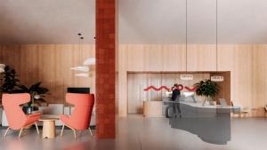 a lobby with red chairs and a table and a counter at Moov Hotel Matosinhos Sul in Matosinhos