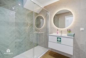 a bathroom with a shower and a sink and mirror at Ondas do Oeste - 3 bedroom villa in Silveira +35 photos