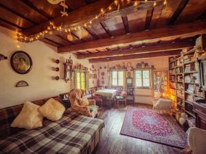 a living room with a couch and a table at Chichotavá breza in Liptovská Anna