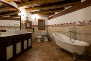 a bathroom with a tub and a sink and a toilet at Hotel Villa Retiro in Xerta +29 photos