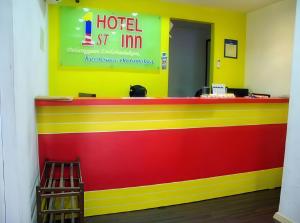 a red yellow and red counter in a hotel room at 1st Inn Hotel Klang Sentral Meru in Klang