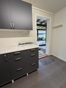 a kitchen with a stove and a counter top at StarapApartment Odda 3 BR in Odda