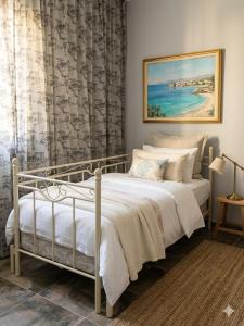 a bedroom with a bed and a painting on the wall at Loft in Kruce in Kruče