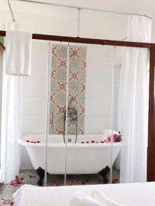 a bathroom with a bath tub in a room at Just Datça in Datca