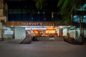 a house with stairs in front of it at night at Harvey's Hotel in Hyderabad